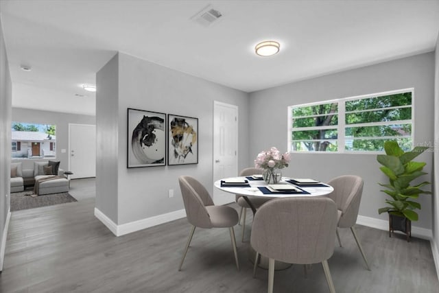 2711 E 22nd Ave, Tampa, FL 33605 - dining space featuring baseboards and wood finished floors
