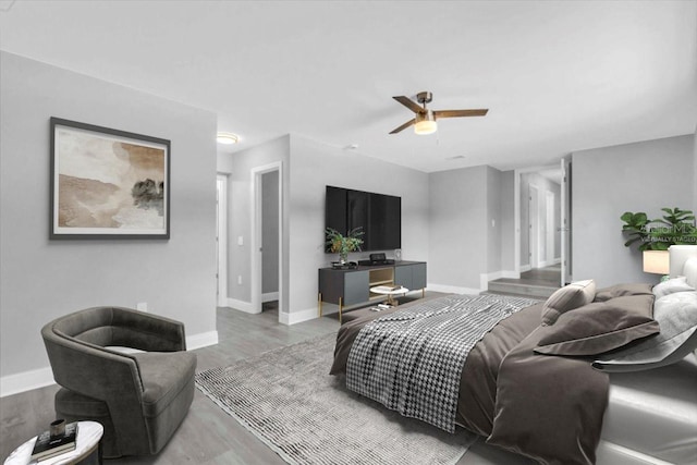 2711 E 22nd Ave, Tampa, FL 33605 - living area featuring baseboards, wood finished floors, and ceiling fan