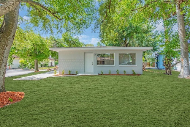 2711 E 22nd Ave, Tampa, FL 33605 - view of front of property with a front yard and brick siding