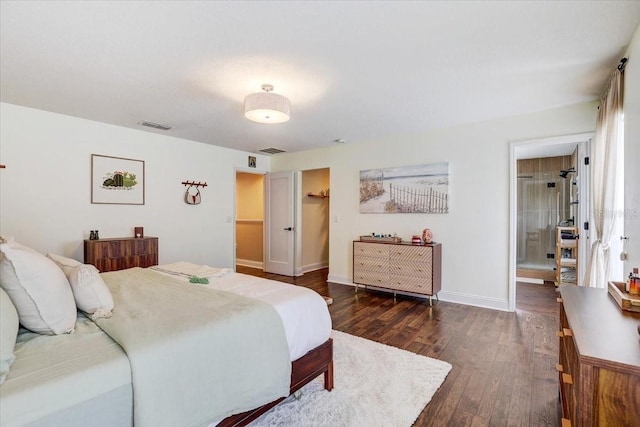 11121 Running Pine Dr, Riverview, FL 33569 - bedroom with dark wood-type flooring, baseboards, and a walk in closet