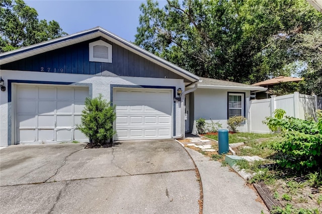 2721 Baird Ct, Palm Harbor, FL 34684 - single story home with fence, driveway, an attached garage, and stucco siding