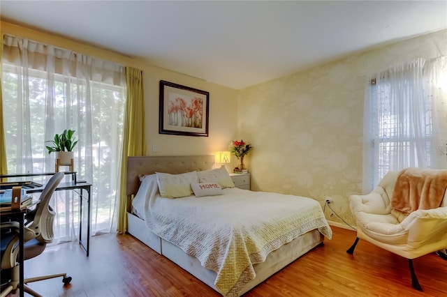 2721 Baird Ct, Palm Harbor, FL 34684 - bedroom featuring wood finished floors and an office area