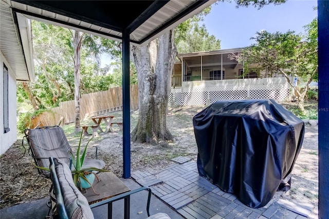 2721 Baird Ct, Palm Harbor, FL 34684 - view of patio with a grill and fence