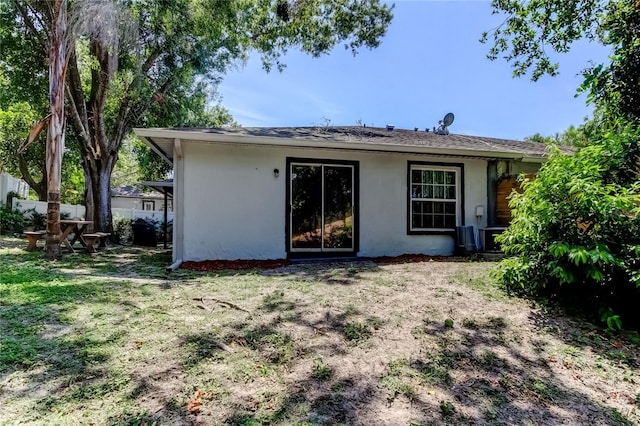 2721 Baird Ct, Palm Harbor, FL 34684 - back of property featuring stucco siding