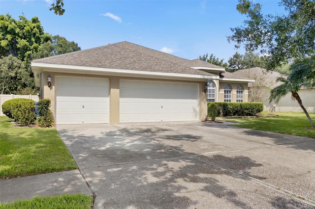 3023 Minuteman Ln, Brandon, FL 33511 - ranch-style home featuring stucco siding, a garage, driveway, and a front lawn