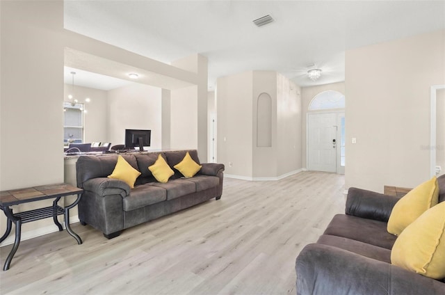 3023 Minuteman Ln, Brandon, FL 33511 - living room with wood finished floors, a chandelier, and baseboards