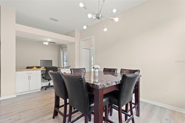 3023 Minuteman Ln, Brandon, FL 33511 - dining area featuring light wood-style floors, baseboards, a chandelier, and a desk