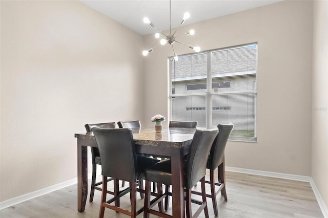 3023 Minuteman Ln, Brandon, FL 33511 - dining area with a chandelier, light wood-style flooring, and baseboards