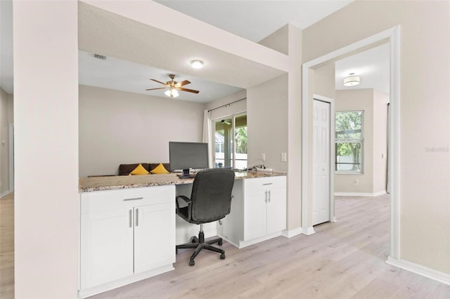 3023 Minuteman Ln, Brandon, FL 33511 - office area with light wood-style flooring, built in desk, baseboards, and a ceiling fan