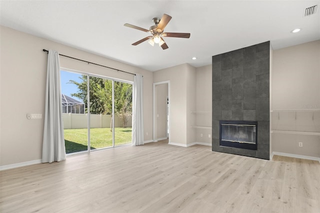3023 Minuteman Ln, Brandon, FL 33511 - unfurnished living room featuring wood finished floors, a ceiling fan, a fireplace, baseboards, and recessed lighting