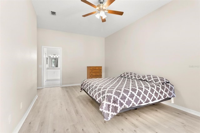3023 Minuteman Ln, Brandon, FL 33511 - bedroom with wood finished floors, baseboards, ensuite bath, and a ceiling fan