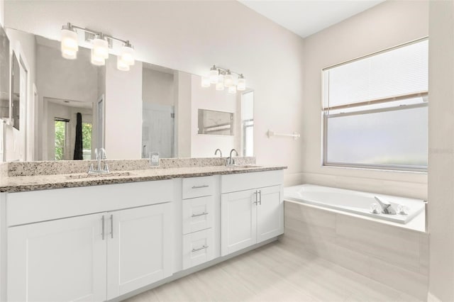 3023 Minuteman Ln, Brandon, FL 33511 - bathroom featuring double vanity and a garden tub
