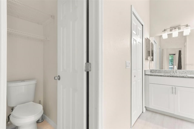 3023 Minuteman Ln, Brandon, FL 33511 - bathroom featuring a closet, vanity, and toilet