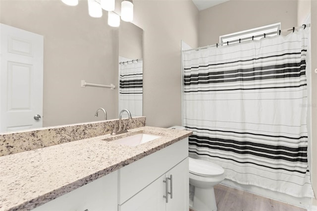 3023 Minuteman Ln, Brandon, FL 33511 - full bathroom featuring vanity, toilet, wood finished floors, and a shower with shower curtain