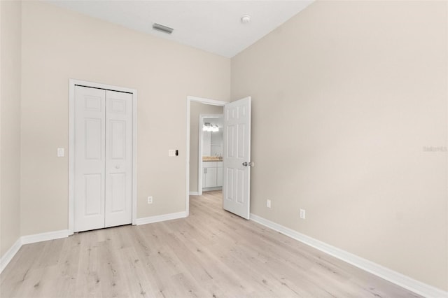 3023 Minuteman Ln, Brandon, FL 33511 - unfurnished bedroom featuring light wood-style flooring, baseboards, and a closet