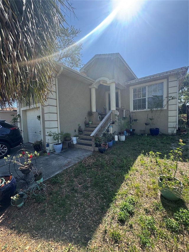 3710 N 57th St, Tampa, FL 33619 - single story home featuring a garage, stucco siding, and a front lawn