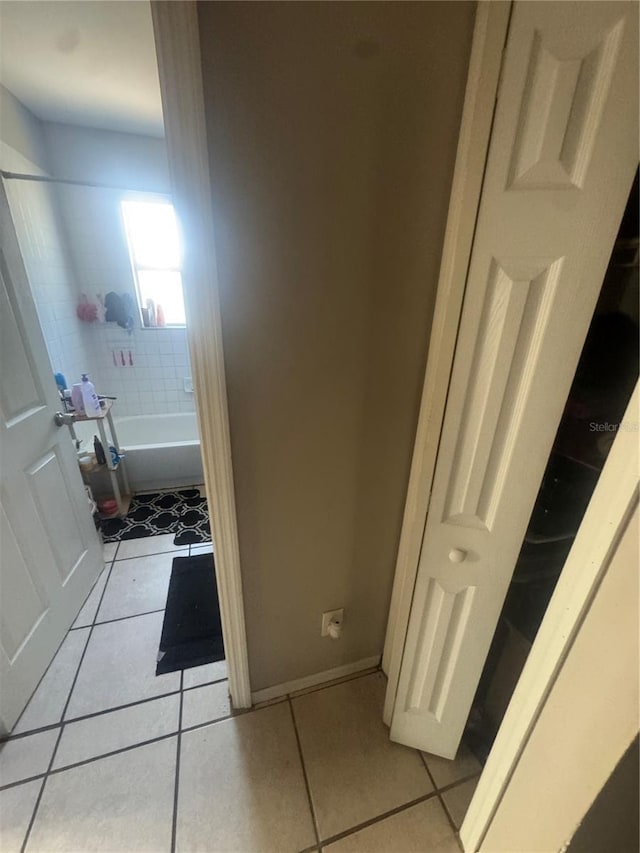 3710 N 57th St, Tampa, FL 33619 - bathroom with tile patterned flooring and baseboards