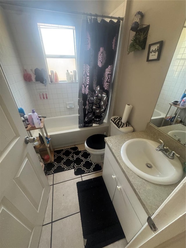3710 N 57th St, Tampa, FL 33619 - full bath featuring tile patterned floors, vanity, toilet, and shower / tub combo with curtain