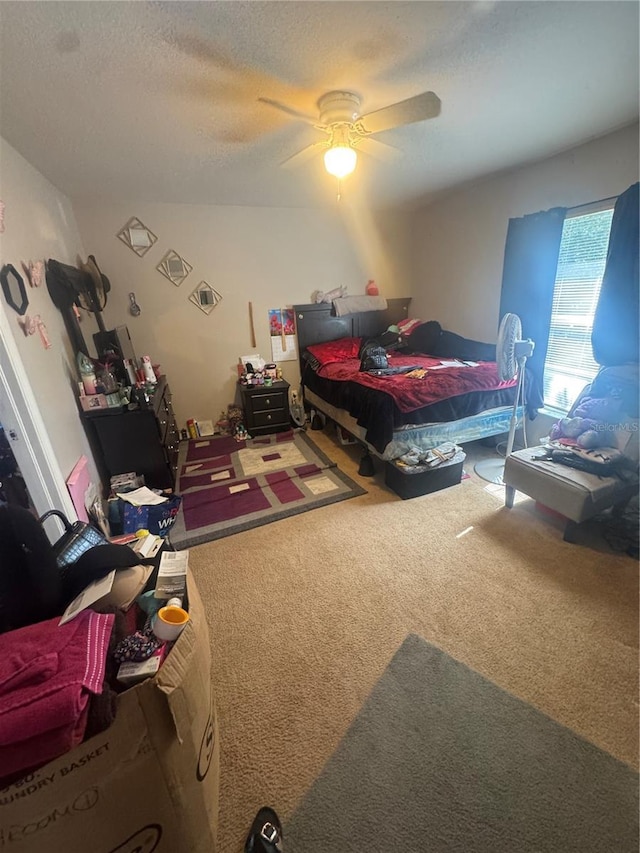 3710 N 57th St, Tampa, FL 33619 - carpeted bedroom with ceiling fan and a textured ceiling