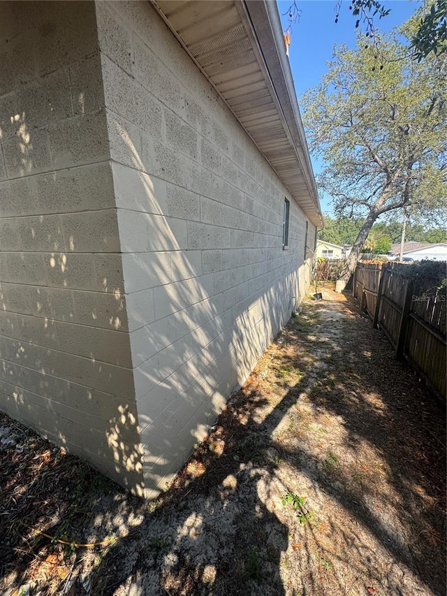 3710 N 57th St, Tampa, FL 33619 - view of property exterior with concrete block siding and fence