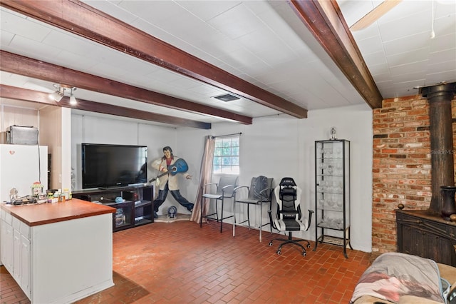 8828 Jasmine Blvd, Port Richey, FL 34668 - living room with brick flooring and beamed ceiling