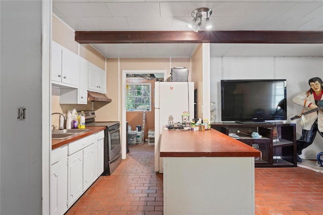 8828 Jasmine Blvd, Port Richey, FL 34668 - kitchen with stainless steel range with electric stovetop, brick flooring, butcher block countertops, a sink, and white cabinetry
