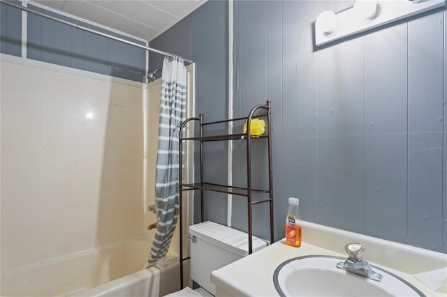 8828 Jasmine Blvd, Port Richey, FL 34668 - full bathroom with a sink, shower / bath combo, toilet, and a decorative wall