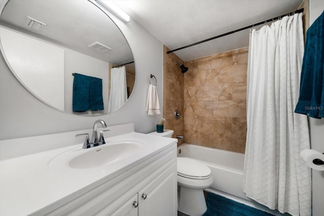 bathroom with shower / bath combination with curtain, toilet, and vanity