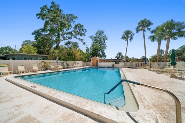 community pool with a patio area
