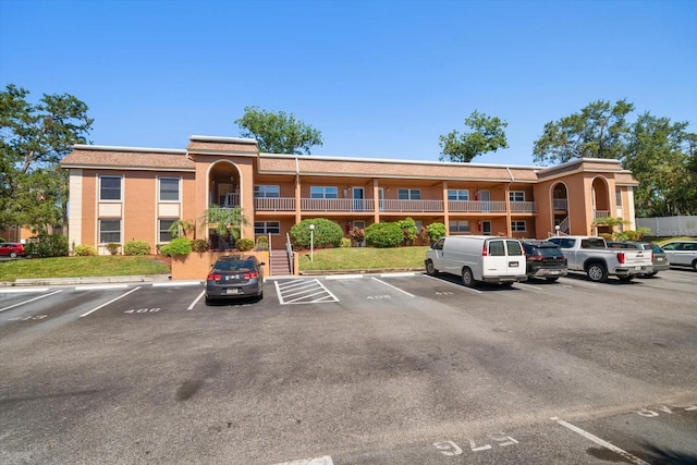 view of property with uncovered parking