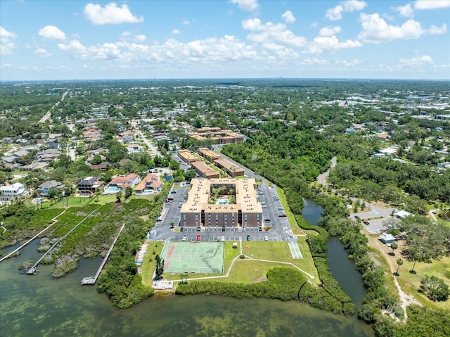 aerial view of property and surrounding area with a large body of water