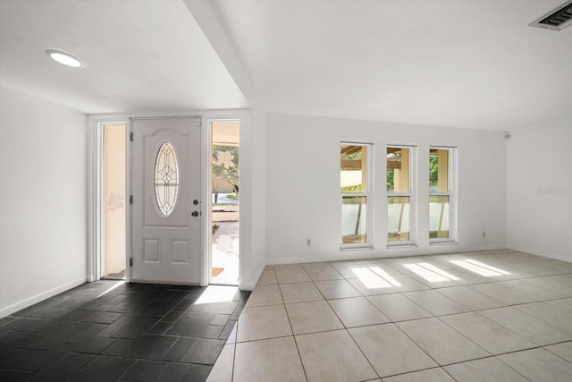 1142 Lancer Ln, Tarpon Springs, FL 34689 - tiled entryway featuring plenty of natural light, baseboards, and recessed lighting