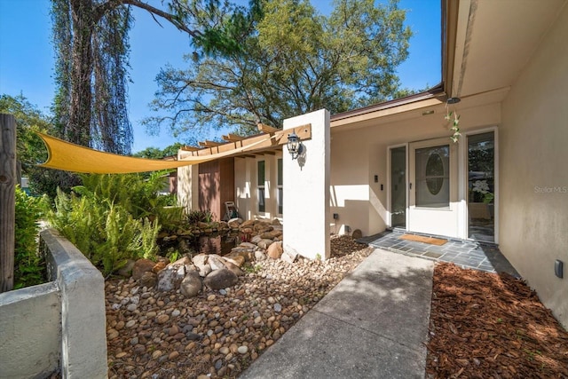 1142 Lancer Ln, Tarpon Springs, FL 34689 - doorway to property featuring stucco siding