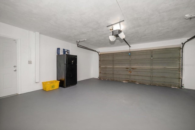 1142 Lancer Ln, Tarpon Springs, FL 34689 - garage featuring freestanding refrigerator and a garage door opener