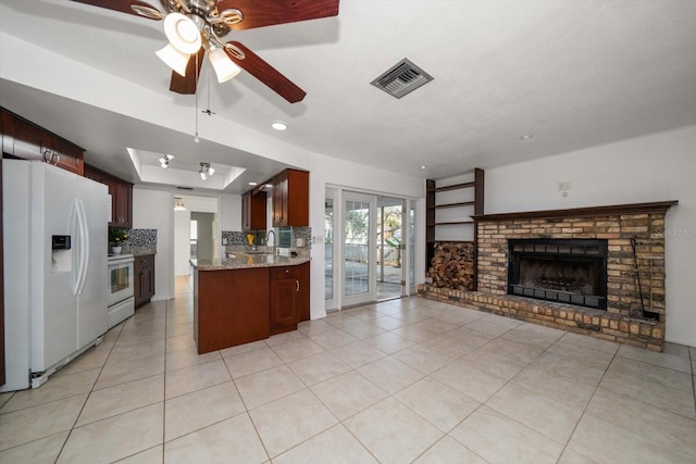 1142 Lancer Ln, Tarpon Springs, FL 34689 - kitchen featuring white appliances, a sink, open floor plan, light tile patterned flooring, and ceiling fan