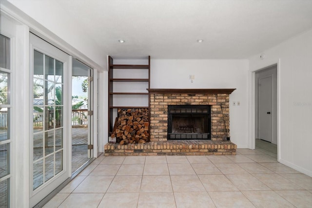 1142 Lancer Ln, Tarpon Springs, FL 34689 - unfurnished living room with a fireplace and light tile patterned flooring