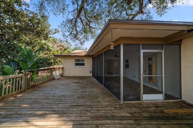 1142 Lancer Ln, Tarpon Springs, FL 34689 - deck featuring a sunroom and a ceiling fan