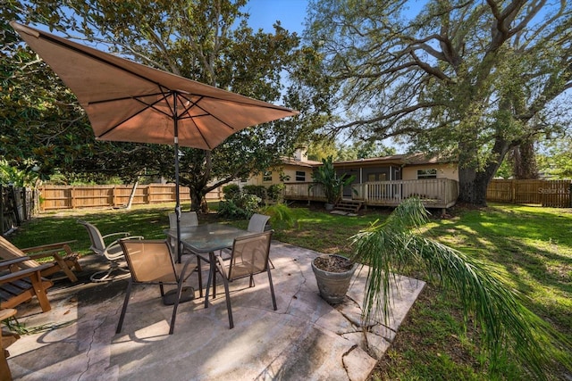 1142 Lancer Ln, Tarpon Springs, FL 34689 - view of patio / terrace featuring a deck and outdoor dining area