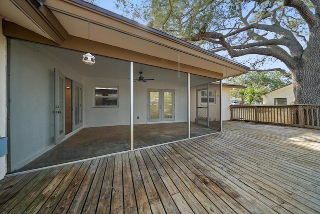 1142 Lancer Ln, Tarpon Springs, FL 34689 - wooden deck with french doors and a ceiling fan