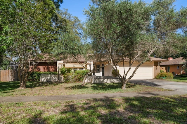 1142 Lancer Ln, Tarpon Springs, FL 34689 - view of front of house featuring asphalt driveway and a garage