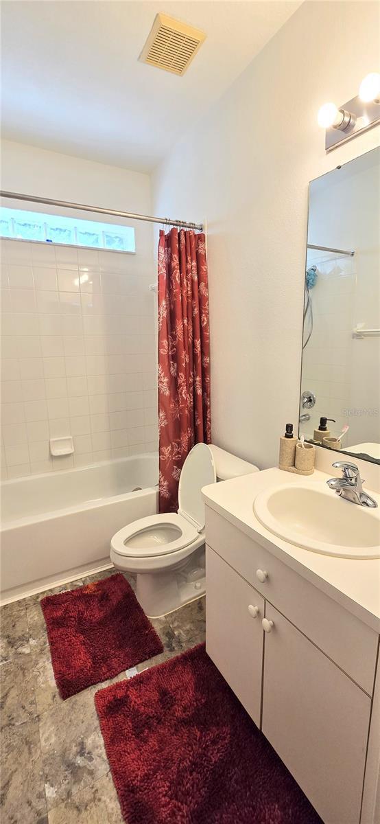15124 Deer Meadow Dr, Lutz, FL 33559 - bathroom with toilet, shower / tub combo, and vanity