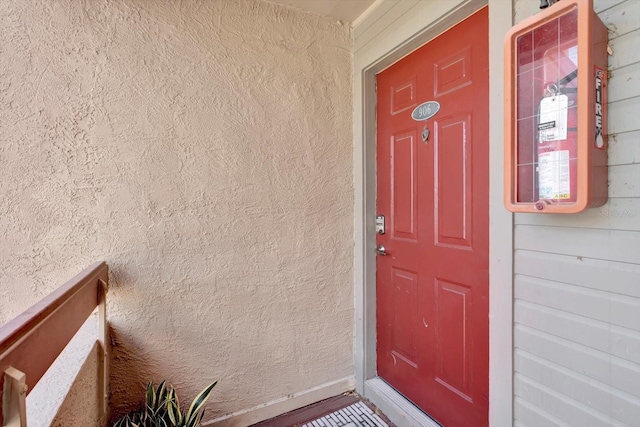 10265 Gandy Blvd N Unit 906, Saint Petersburg, FL 33702 - view of exterior entry featuring stucco siding