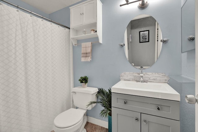 10265 Gandy Blvd N Unit 906, Saint Petersburg, FL 33702 - bathroom with vanity, toilet, and wood finished floors