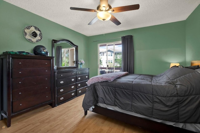 10265 Gandy Blvd N Unit 906, Saint Petersburg, FL 33702 - bedroom featuring a textured ceiling, light wood-style flooring, and ceiling fan