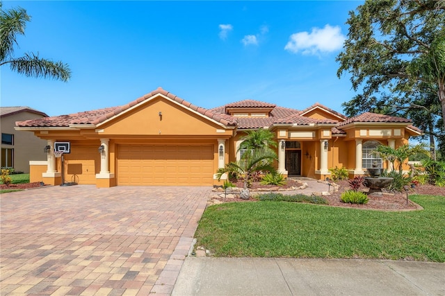 800 Belted Kingfisher Dr S, Palm Harbor, FL 34683 - mediterranean / spanish-style home with stucco siding, an attached garage, decorative driveway, and a front lawn