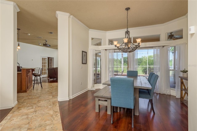 800 Belted Kingfisher Dr S, Palm Harbor, FL 34683 - dining area featuring a chandelier, wood finished floors, and baseboards