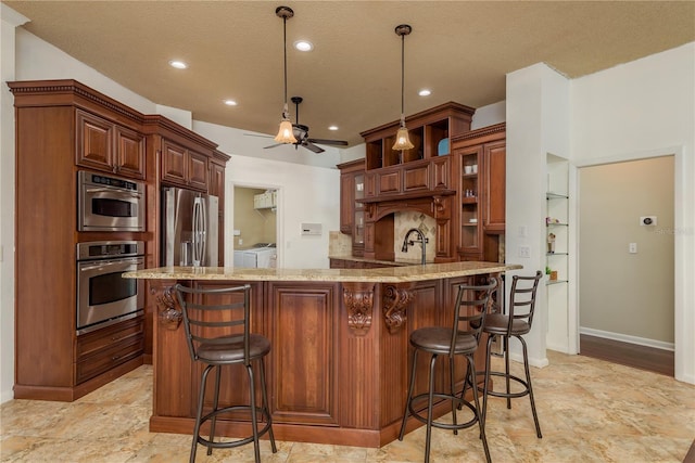 800 Belted Kingfisher Dr S, Palm Harbor, FL 34683 - kitchen with stainless steel refrigerator with ice dispenser, separate washer and dryer, a textured ceiling, a breakfast bar, and baseboards
