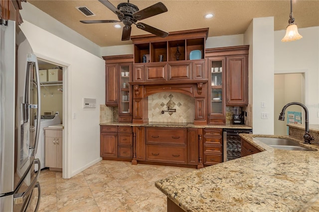 800 Belted Kingfisher Dr S, Palm Harbor, FL 34683 - kitchen featuring a sink, wine cooler, brown cabinetry, tasteful backsplash, and a textured ceiling