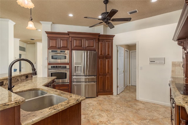 800 Belted Kingfisher Dr S, Palm Harbor, FL 34683 - kitchen with appliances with stainless steel finishes, a sink, a ceiling fan, a textured ceiling, and hanging light fixtures