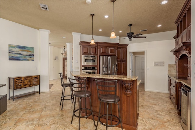 800 Belted Kingfisher Dr S, Palm Harbor, FL 34683 - kitchen featuring stainless steel appliances, a textured ceiling, a ceiling fan, light stone countertops, and recessed lighting